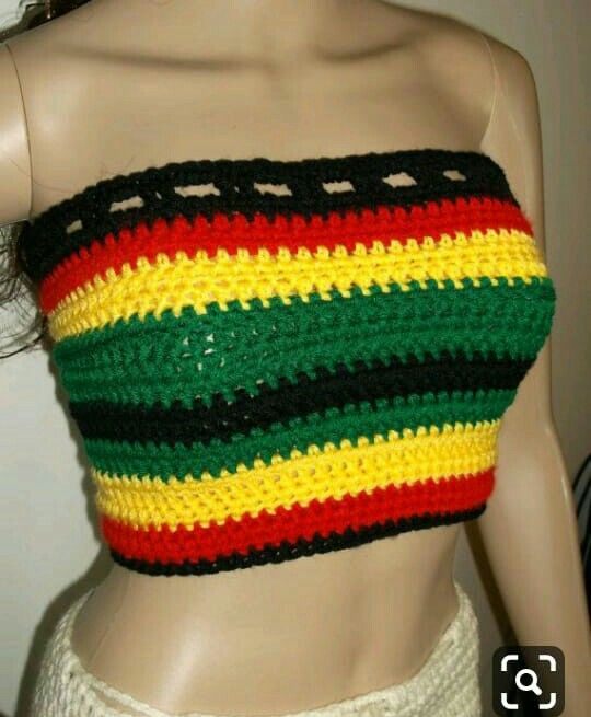 a close up of a mannequin's torso wearing a multicolored crop top