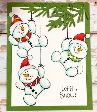 two snowmen hanging from a christmas tree with the words let it snow on them