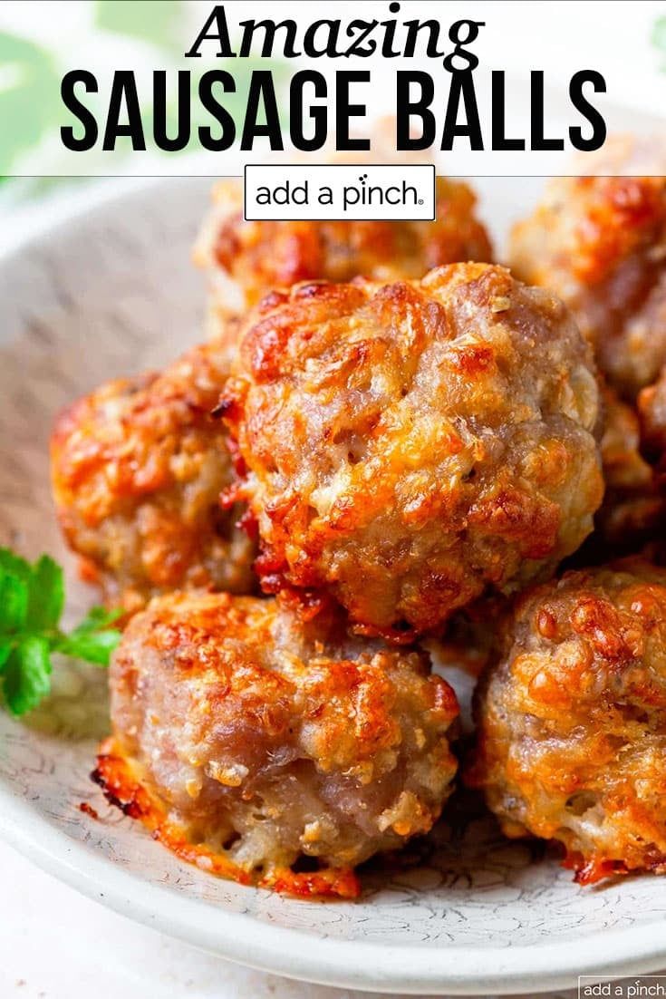 some meatballs on a white plate with parsley