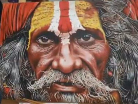 an old man with a red and yellow headdress