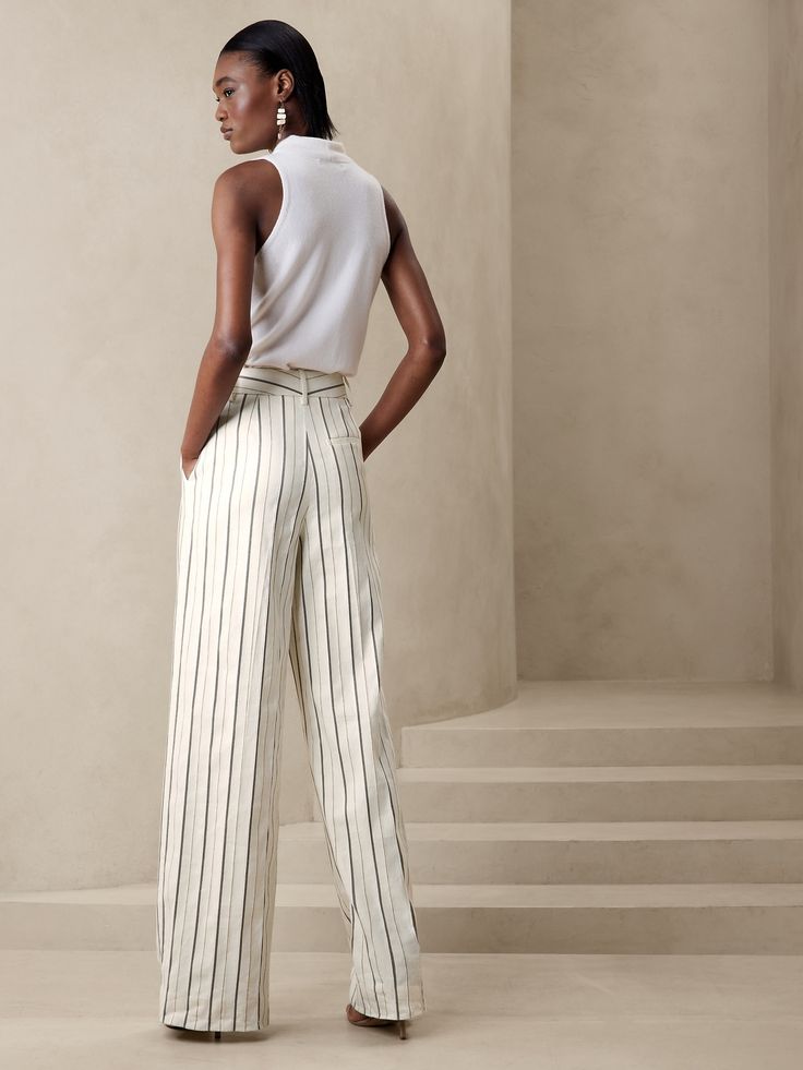 A wardrobe wonder, our designers chose a luxurious cotton-linen fabric for these flowing, wide-leg pants, specially woven with shades of beige and ivory for a striped effect that's ready for warm-weather adventures.  RELAXED WIDE-LEG FIT: High waiste Chic Wide Leg Pants With Vertical Stripes For Summer, Elegant Striped Linen Bottoms, Chic Striped Linen Bottoms, Spring Linen Pants With Vertical Stripes, Chic White Wide Leg Pants With Vertical Stripes, Elegant White Striped Pants, Elegant White Pants With Vertical Stripes, Striped Linen Wide Leg Pants For Summer, Striped Wide-leg Linen Pants