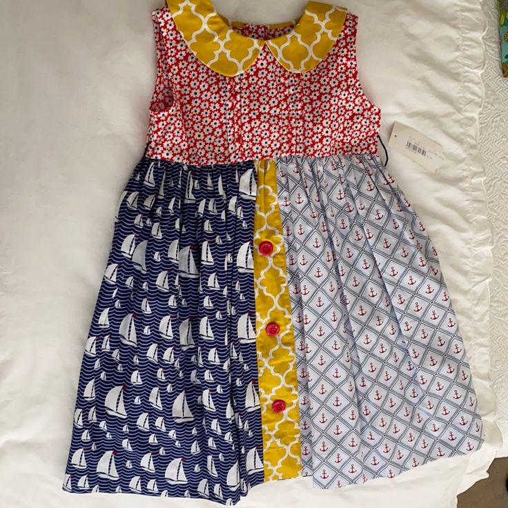 Sailboat Sundress Cute Navy Sleeveless Dress, Cute Sleeveless Navy Dress, Nautical Navy Cotton Dress, Navy Nautical Cotton Dress, Navy Cotton Nautical Dress, Fun Red Dresses For Playtime, Fitted Cotton Nautical Dress, Blue Nautical Cotton Dress, Spring Nautical Cotton Dress