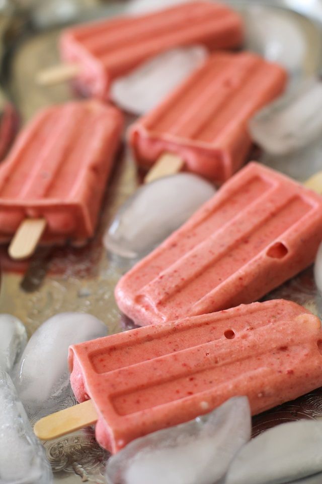 popsicles are sitting on top of ice cubes