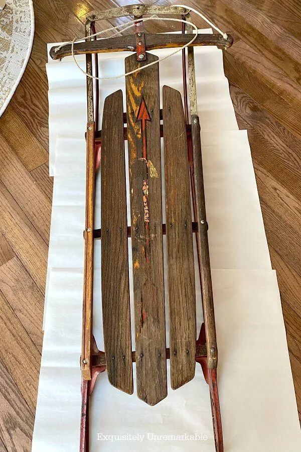 an old wooden sled with arrows on it