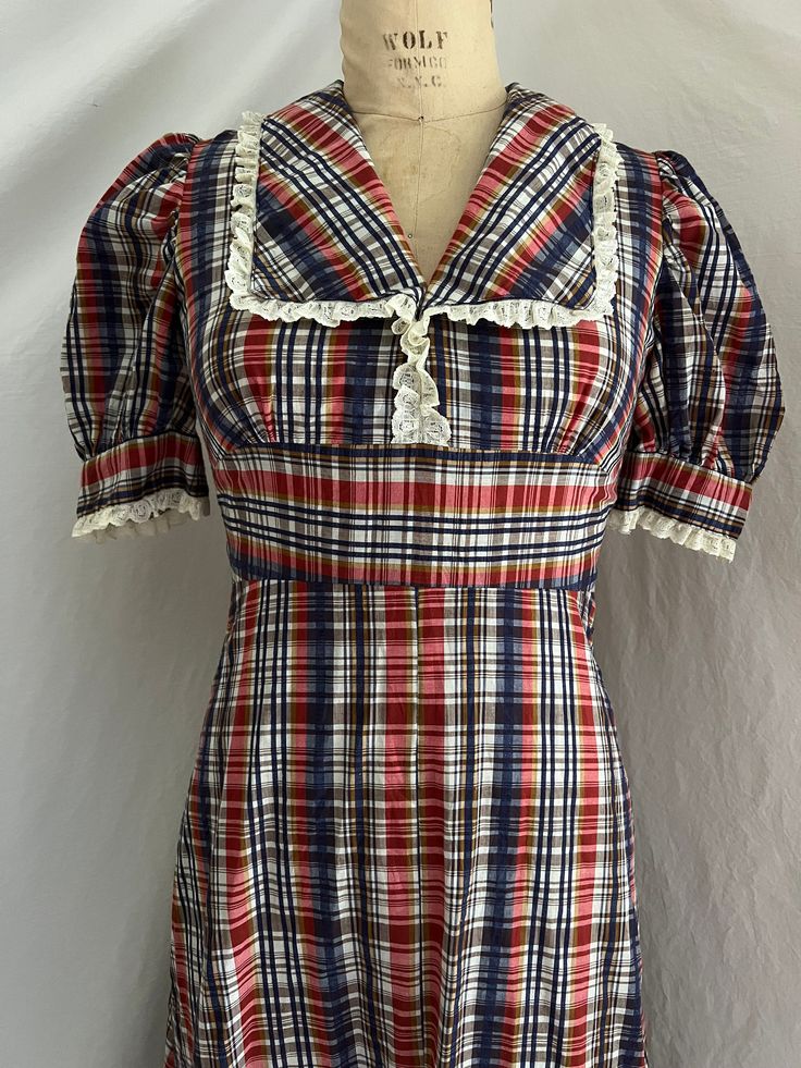 1960s madras plaid prairie maxi dress. Love the silhouette on this dress! Puffed sleeves, wide waistband into an a-line skirt. Big collar with lace trim detailing. Attached waist tie. Center back metal zip. No tags. Cotton. Excellent condition. Washed and ready to wear.  MEASUREMENTS(taken flat, double when appropriate) PTP 17 Underbust 15 Waist 13 1/2 Hips 20 Length 55 This is the perfect unique gift for a loved one, or yourself! Please be sure to email all questions before purchasing, as I do Vintage Cotton Dress For Summer, Retro Cotton Lined Dresses, Fitted Cotton Vintage Dress For Daywear, Cotton Dresses With Retro Print For Summer, Retro Cotton Vintage Dress With Vintage Pattern, Retro Cotton Dress With Vintage Pattern, Fitted Cotton Dress With Retro Print, Summer Retro Cotton Vintage Dress, Retro Vintage Summer Dress