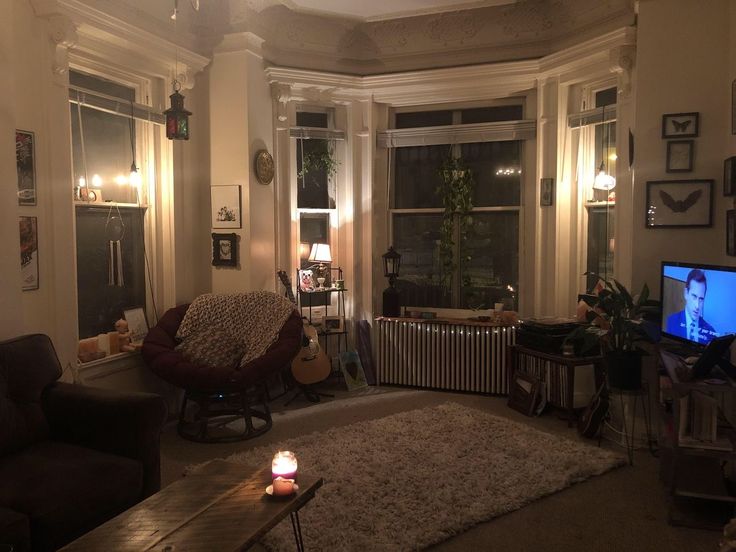 a living room filled with furniture and a flat screen tv