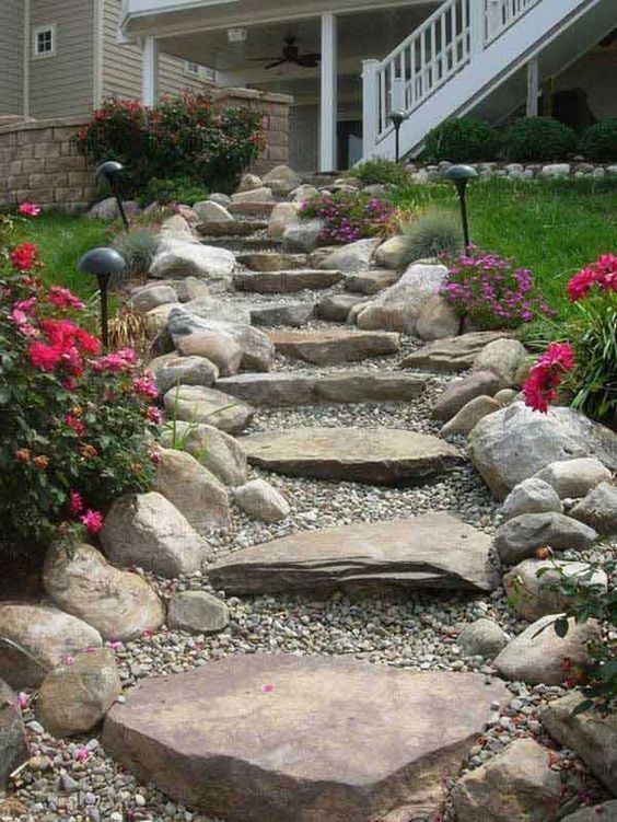 there is a stone path that leads up to the house