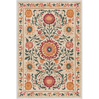 a rug with flowers and leaves on it