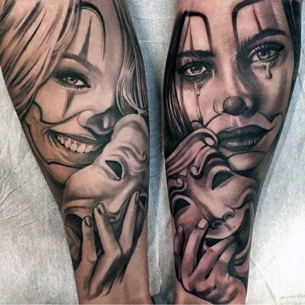 two people with faces painted on their legs and one is holding a woman's face