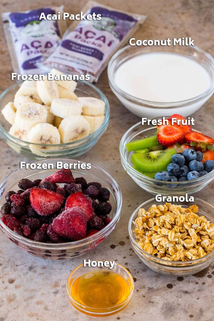 the ingredients to make an oatmeal smoothie include bananas, strawberries, blueberries, kiwis, and yogurt