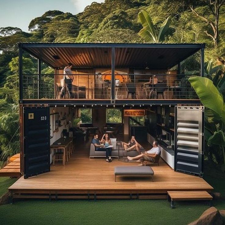 two people sitting on couches in front of a shipping container with open floor plans