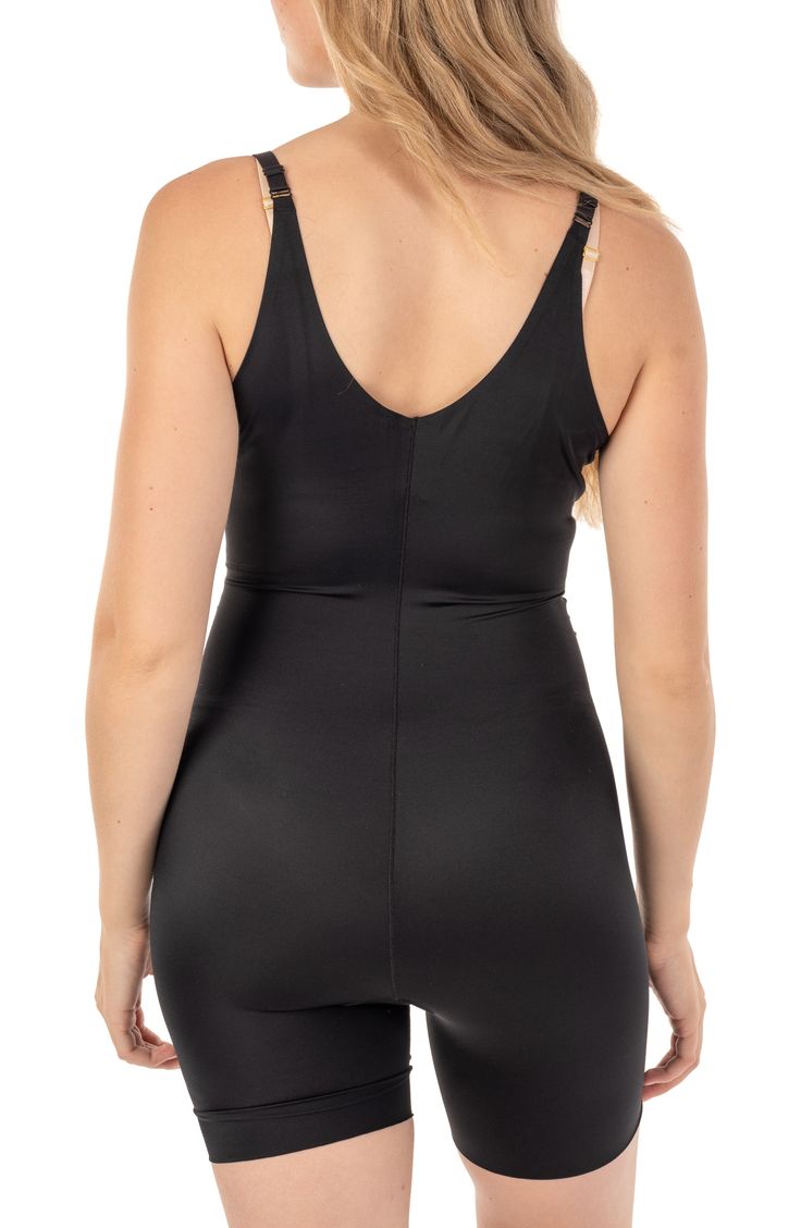 Designed to slim you in all the right places. Targeted fused front panel keeps your stomach looking toned. High spandex content smooths and slims your hips and thighs. 24 1/2" length; 8" rise (size Small-Medium) Scoop neck 85% nylon, 15% spandex Machine wash, dry flat Imported Model stats: 5'10" height, 32" bust, 25" waist, 36" hip. Model is wearing size Small-Medium. Fitted Nylon Tankini With Built-in Padding, Fitted Sports Shapewear With Built-in Bra, Fitted Shapewear Bodysuit With Built-in Padding, Sleek Fitted Swimwear With Built-in Bra, Fitted Workout Tankini With Built-in Bra, Fitted Shapewear With Built-in Bra For Yoga, Fitted Shapewear With Built-in Padding For Workout, Fitted Sleeveless Unitard With Built-in Bra, Black Swimwear With Medium Bust Support And High Stretch