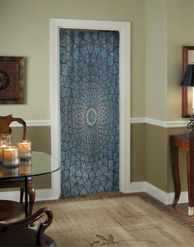 a room with a glass door that has a decorative design on the front and side