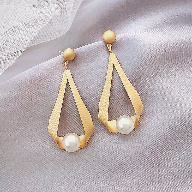 * Buy 2 sets of women’s pearl earrings and receive a free jewelry organizer * Buy more than 2 sets of women’s pearl earrings to receive a $10 discount and a free mirror jewelry organizer Vintage Pearl Earrings Take a look at our beautiful pearl earring design. These pearl drop earrings have been designed by a nature-originated jewelry designer and are made with faux pearls to give you an affordable and vintage style. Made with shell pearls and silver pins, these pearl earrings are easy to care f Elegant Mother's Day Pearl Earrings For Pierced Ears, Elegant Gold Earrings For Mother's Day, Elegant Hypoallergenic Earrings For Mother's Day, Elegant Pearl Drop Earrings For Mother's Day, Elegant Gold Pearl Earrings For Mother's Day, Gold Earrings For Mother's Day Formal Occasion, Elegant Dangle Pearl Earrings For Mother's Day, Hypoallergenic Gold Pearl Earrings For Party, Mother's Day Dangle Pearl Earrings