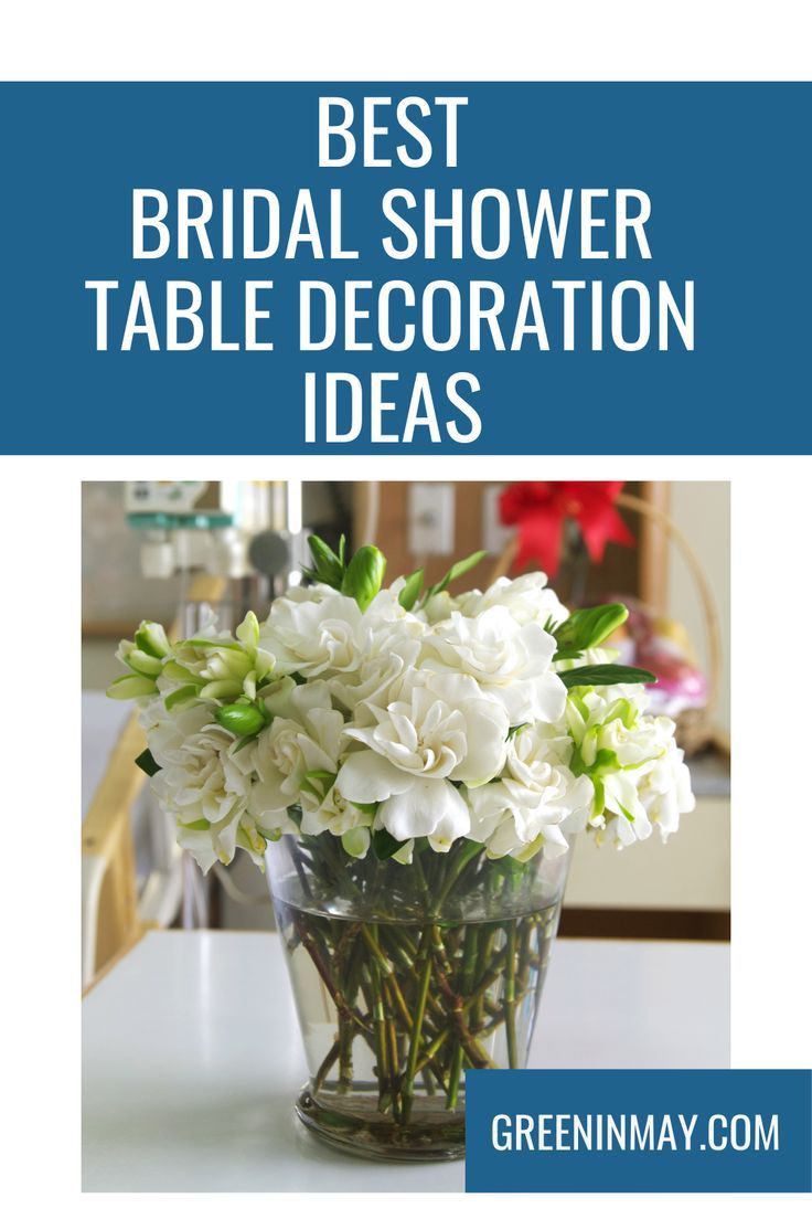 a vase filled with white flowers on top of a table next to the words best bridal shower table decoration ideas