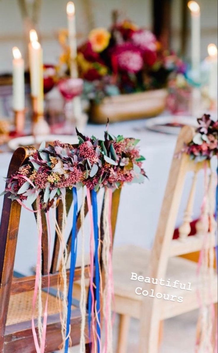 the chairs are decorated with flowers and ribbons