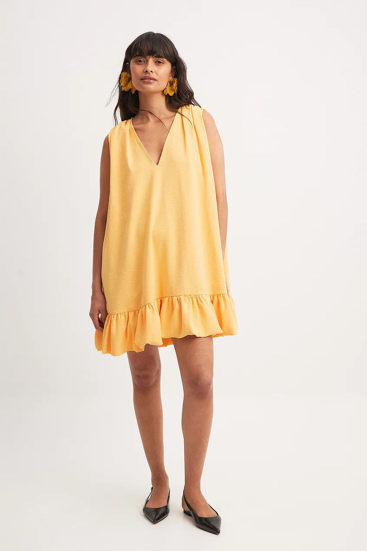 Frill Detail Sleeveless Mini Dress V-neck Ruffled Sundress Mini Dress, V-neck Ruffle Hem Sundress, Ruffled Mini V-neck Dress For Vacation, Summer Sleeveless V-neck Dress With Ruffles, Chic Yellow Sleeveless Mini Dress, Yellow V-neck Dress With Ruffle Hem, Vacation Sleeveless Mini Dress With Ruffle Hem, Vacation Mini Sleeveless Dress With Ruffle Hem, Sleeveless Mini Sundress With Ruffle Hem