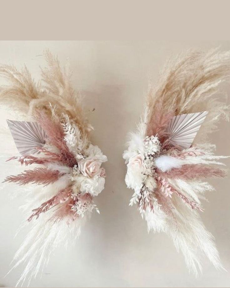 two white and pink feathers with flowers on them