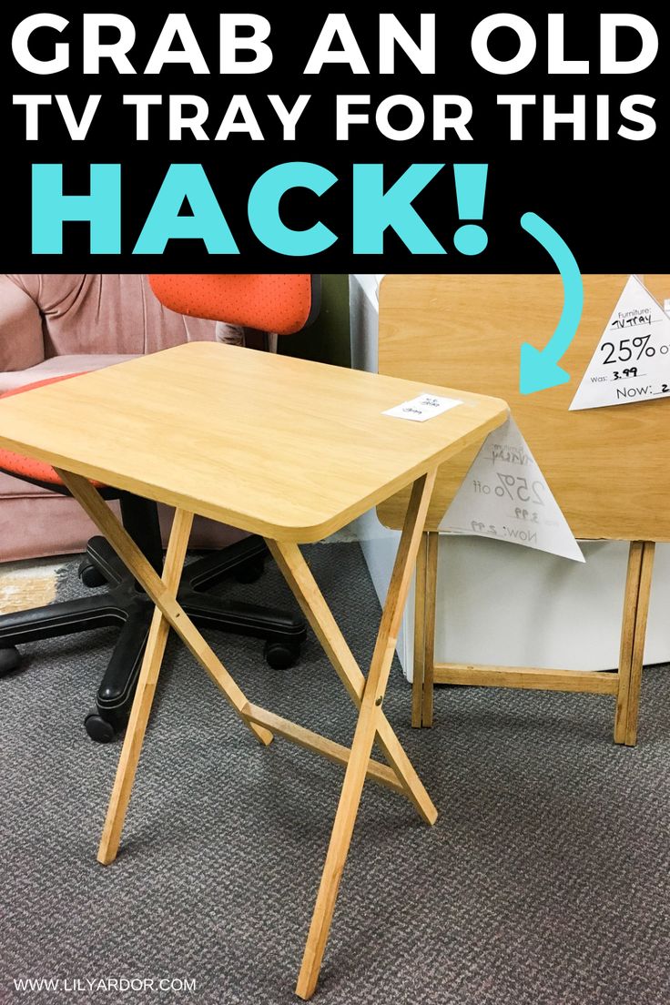 an old tv tray for this hack is on the floor next to a table with a sign that reads grab an old tv tray for this hack