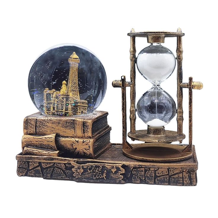 an old timey hourpiece with a glass globe on top and a book under it