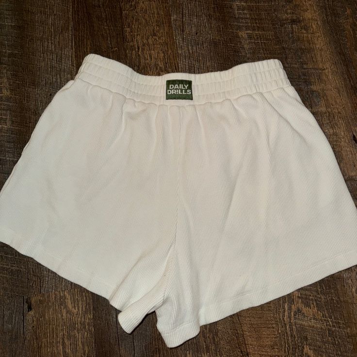 Size M/L Great Condition - Never Worn! I Just Ordered The Wrong Size. White Bottoms With Built-in Shorts For Daywear, White Bottoms With Elastic Waistband For Day Out, White Bottoms With Elastic Waistband In Short Length, White Bottoms With Elastic Waistband, Short Length, Casual White Short Bottoms, Casual White Short Length Bottoms, Casual Cream Bottoms For Daywear, White Relaxed Fit High-waisted Shorts, Sporty Short Cream Bottoms