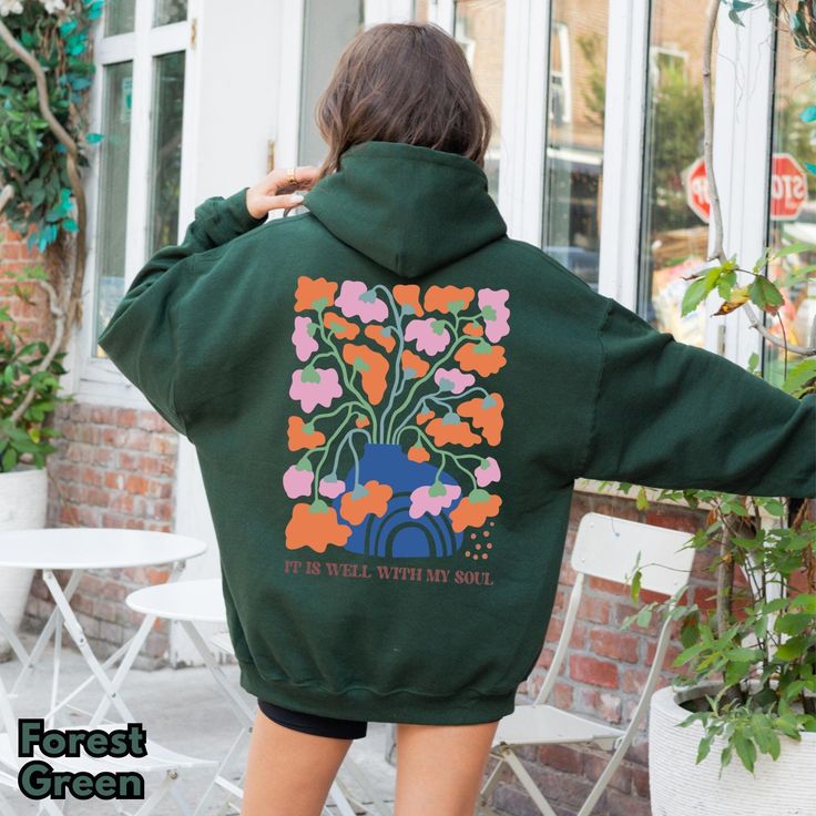 This Christian Wildflower Hoodie features the comforting message "It Is Well With My Soul," combined with a vibrant and artistic floral design. Perfect for expressing your faith in a stylish, boho aesthetic, this hoodie is a cozy and trendy addition to any wardrobe. Whether you're wearing it to church, relaxing at home, or gifting it to a loved one, this Bible verse hoodie serves as a reminder of inner peace and God's presence. Its oversized fit and bold design make it the perfect mix of fashion My Soul Aesthetic, Boho Bible, Soul Aesthetic, God's Presence, Aesthetic Boho, Sweatshirt Trendy, It Is Well With My Soul, Boho Aesthetic, It Is