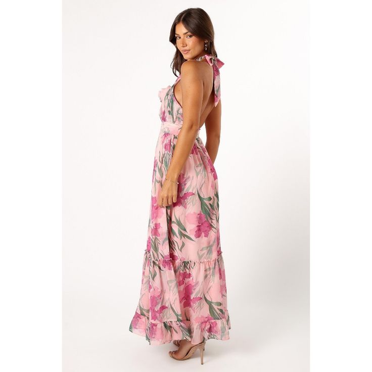 Its halter neck, complete with a stylish tie close, gives a fun nod to the latest trends. The detachable center flower adds an unexpected whimsical twist â€“ it's a conversation starter! But wait, there's more. Turn around to reveal a daring open back, adding that extra dose of sass to your style. Flirty Floral Print Maxi Dress For Beach, Flirty Floral Print Summer Maxi Dress, Flirty Floral Print Maxi Dress For Summer, Spring V-neck Halter Dress For Garden Party, Flirty Summer Maxi Dress With Tie Back, Spring Flirty Maxi Dress With Tie Back, Chic Fitted Floral Halter Top, Pink Fitted Halter Dress With Tie Back, Chic Fitted Halter Dress With Floral Print