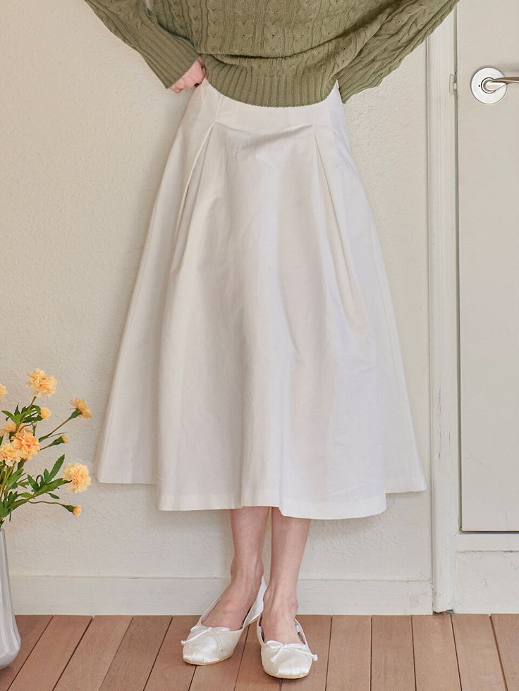 Editor's NotesThis can create a lovely mood with a long length and flared skirt. Especially, if you wear it with a tweed jacket, you can create a feminine silhouette.- Deep and wide crease detail- Relaxed fit- 2 Colors: Ivory, Beige*Product image color may differ slightly from actual color depending on the resolution of your monitor.Measurements (inch)S / M - Waist: 12.40 in. / 13.19 in.- Hip: 17.72 in. / 18.50 in.- Hem: 19.69 in. / 20.08 in.- Length: 23.62 in. / 24.02 in.*Model size: Height 5'64 (wearing S size)*There may be a difference of 0.4 in. to 1.18 in. depending on where the size is measured.Composition & Care- 65% Cotton, 28% Rayon, 7% Nylon- Dry cleaning recommended for first wash- In order to maintain the unique fit and color of denim for a long time, please avoid frequent Classic A-line Skirt For Daywear, White A-line Skirt For Fall, Elegant A-line Pleated Skirt For Daywear, Chic Cotton A-line Pleated Skirt, Elegant A-line Cotton Skirt, Elegant Cotton A-line Pleated Skirt, Relaxed Fit Skirt With Wide Hem For Spring, Relaxed Spring Skirt With Wide Hem, Elegant Cotton Skirt