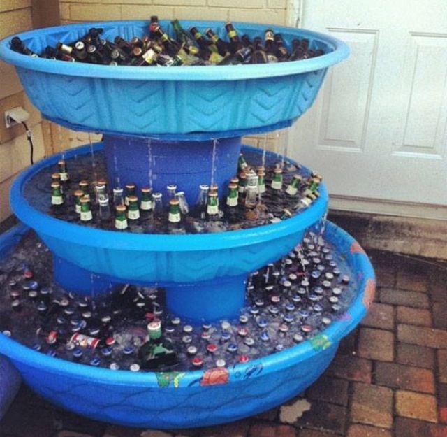 an image of a three tiered fountain made out of plastic cups and bottles on the bottom