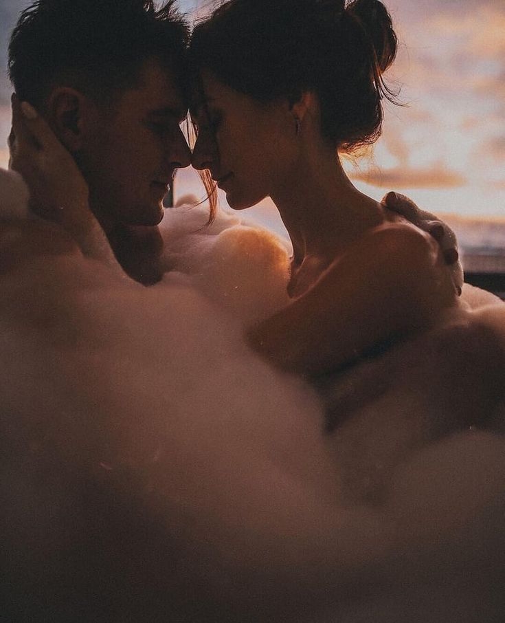 a man and woman are in the bathtub with steam coming out of their heads