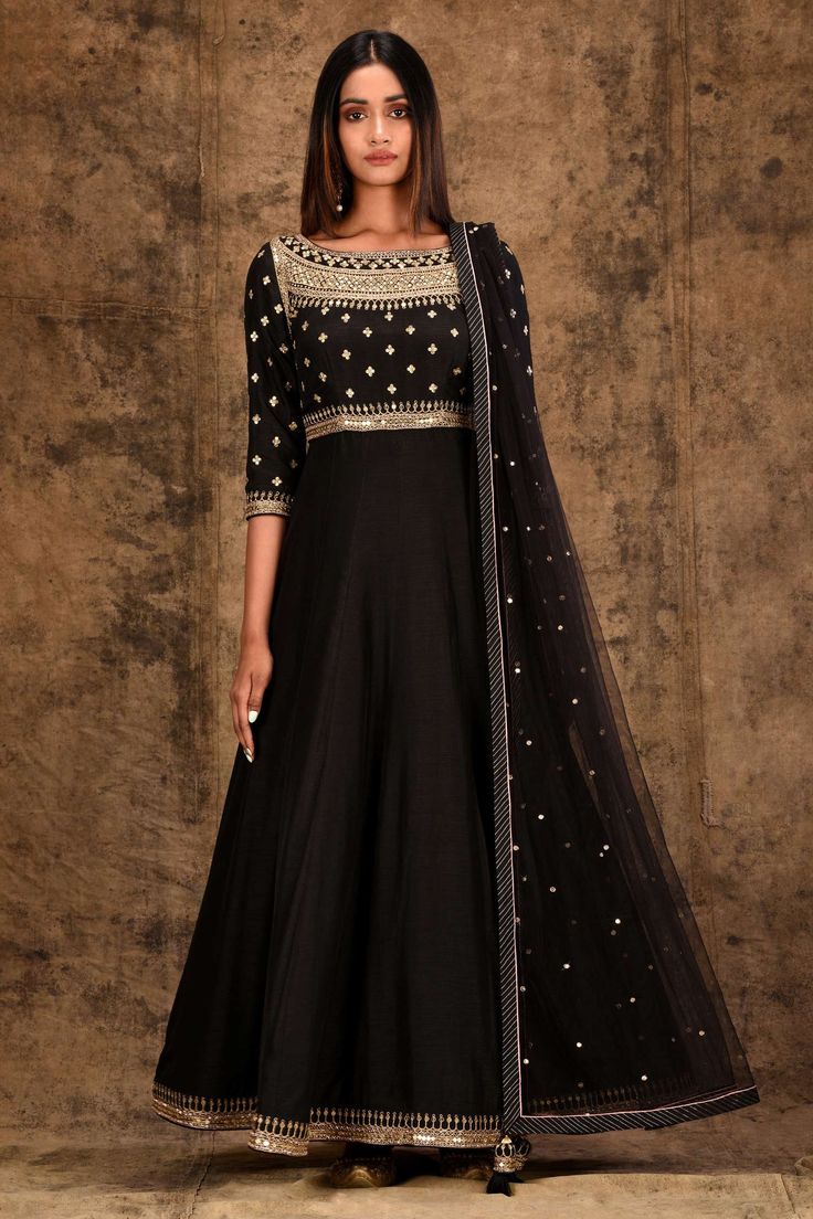 Black anarkali with placement floral motif sequin work. Comes with churidar and embellished dupatta.
Components:3
Embroidered
Neckline:Round
Sleeve Length:Three Quarter
Fabric:Tusser Georgette, Modal satin, Butterfly net
Color:Black
Striped border dupatta
Closure: Side zip - Aza Fashions Black Anarkali, Silk Anarkali, Embroidered Anarkali, Palazzo Set, Embroidered Neckline, Designer Gowns, Set For Women, Festival Wear, Traditional Dresses