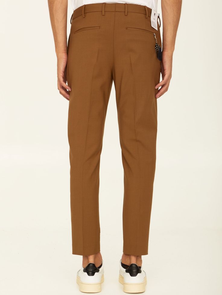 Straigh-leg pleated trousers in camel virgin wool. It feautres concealed zip and hook-and-eye closure, two side welt pockets, two rear welt pockets and belt loops. The model is 188cm tall and wears size 48.  Size nationality: IT  Product number: 5042  Product code: COAFX0Z00FWDTO550080  Composition: 95% virgin wool, 5% elastane Brown Pressed Crease Office Bottoms, Tailored Brown Bottoms For Work, Brown Tailored Tapered Leg Bottoms, Tailored Brown Bottoms With Tapered Leg, Tailored Straight Hem Brown Bottoms, Brown Tailored Bottoms With Straight Hem, Brown Office Pants With Pressed Crease, Brown Trousers With Pressed Crease, Brown Ankle-length Dress Pants With Welt Pockets