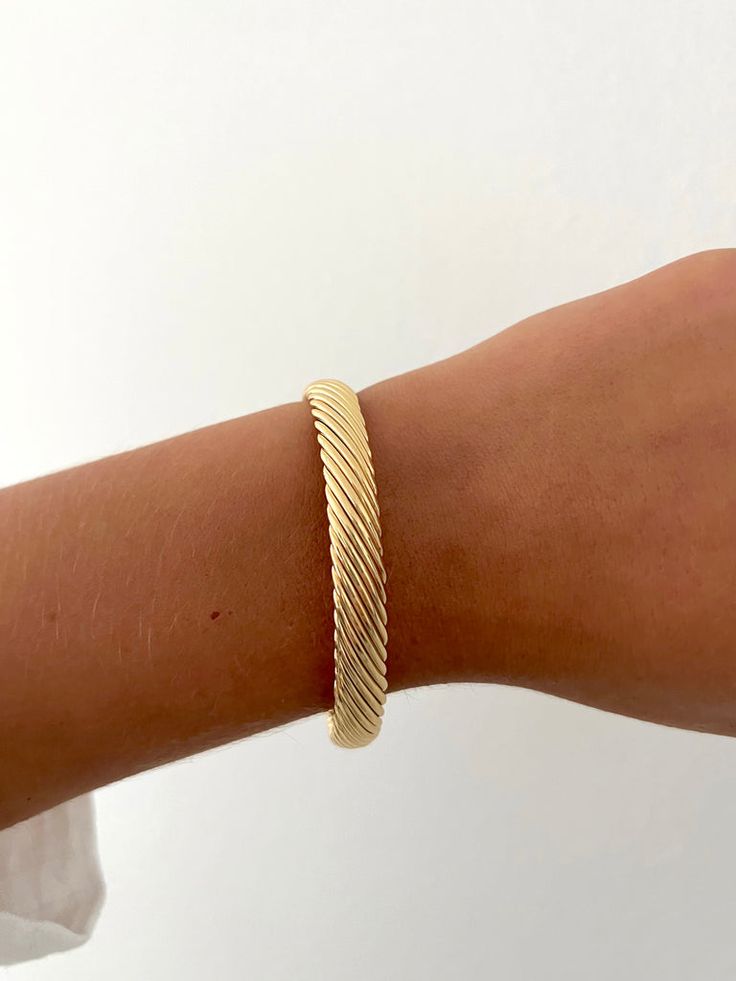 Classic Gold Cuff Bracelet With Oyster Detail, Trendy Gold Cuff Bracelet With Jubilee Style, Timeless Adjustable Cuff Bracelet With Strap, Adjustable 14k Gold Bangle Bracelet, Trendy Cuff Bracelet With Strap, Trendy Cuff Bracelet Jewelry, Adjustable 14k Gold Tarnish-resistant Bracelet, Trendy Gold-plated Tarnish-resistant Bangle, Trendy Gold Bangle Cuff Bracelet