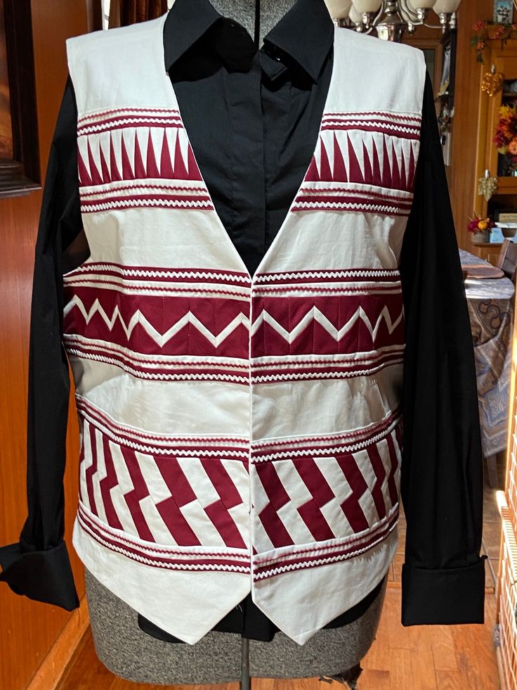 New Seminole Patchwork Vest featuring 3 rows of patchwork, made of 100% cotton and fully lined. Any size can be made and customized. Custom orders will take 2-4 weeks to complete. I am a member of the Seminole Nation of Oklahoma. Fitted Cotton Folk Outerwear, Fitted Cotton Vest With Embroidery, Fitted Embroidered Cotton Vest, Folk Style Fitted Cotton Outerwear, Traditional Fitted Cotton Outerwear, Fitted Folk-style Cotton Outerwear, Fitted Cotton Embroidered Vest, White Embroidered Cotton Vest, Traditional Fitted White Vest