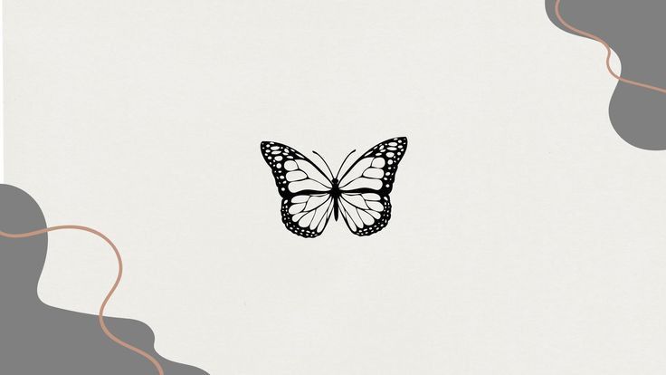 a black and white butterfly flying over the top of a gray wall with swirls on it