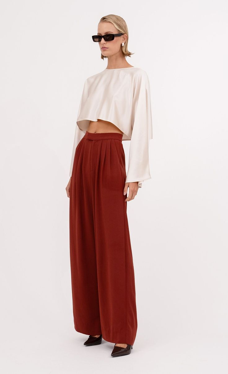 The Santana Pant is a must-have for your fall wardrobe. The soft satin in the rich rust color adds a touch of elegance to everyday looks. Easily dressed up or down, make it your new go-to statement pants. Elegant Kimono, Statement Pants, Baby Tank, Denim Hat, Kimono Sleeves, Kimono Sleeve, Rust Color, Engineered Garments, Summer Accessories