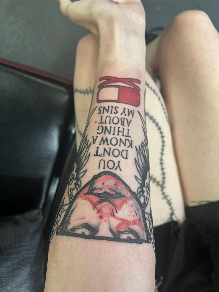 a woman's arm with tattoos on it and the words, this world is mine