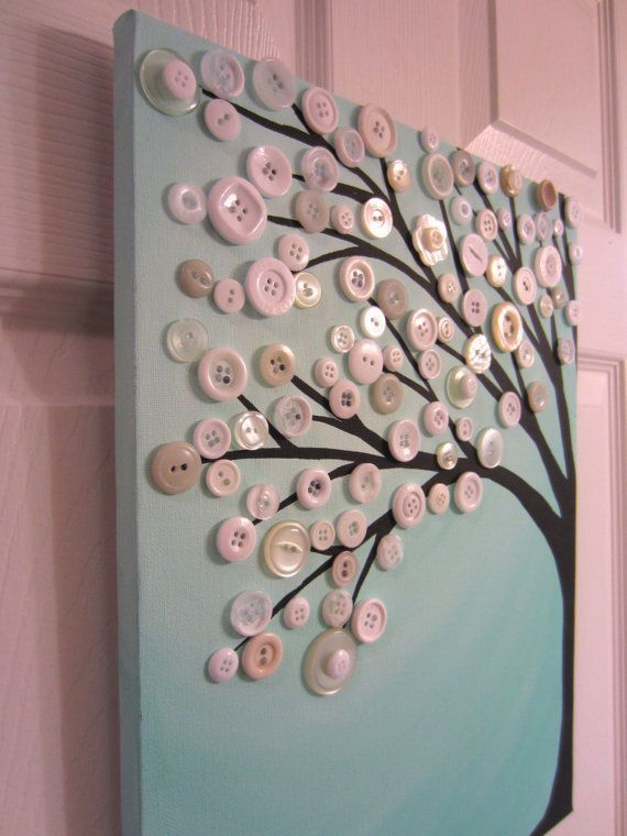 a tree made out of buttons on a wall