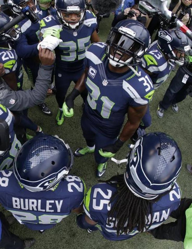 a group of football players standing next to each other