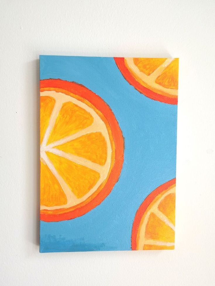 an orange slice on a blue background is featured in this acrylic art work