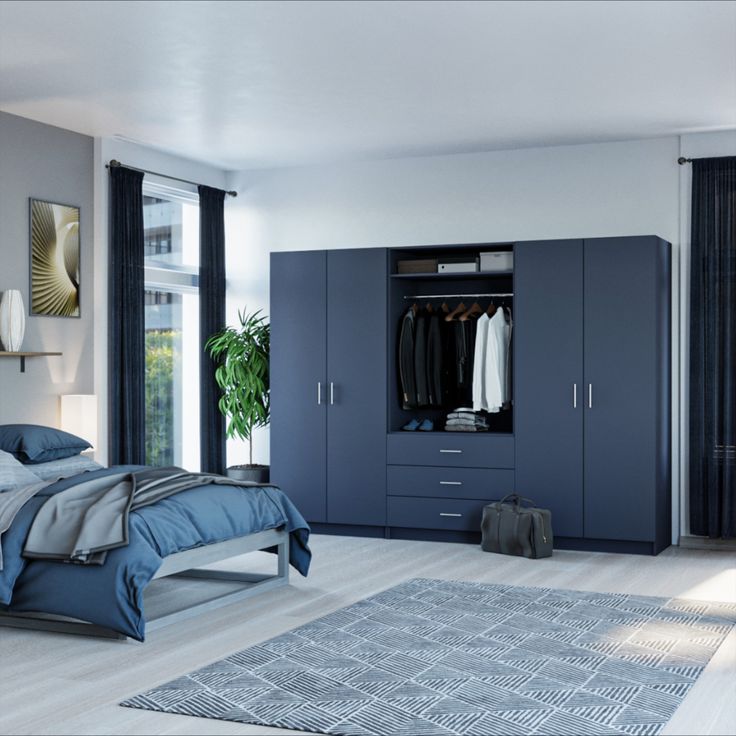 a bedroom with a bed, dresser and wardrobes in blue tones is seen here