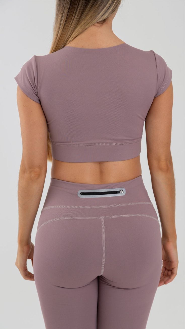 Currently obsessing over this crop top. Cropped length for easy pairing with high rise leggings.Designed for your effortless gym to street looks! Made in Colombia, 100% Authentic Tight fit for a body-hugging feel Machine wash Compression Crop Top For Gym, Breathable Cropped Activewear For Workout, Breathable Cropped Activewear For Training, High Stretch Sports Crop Top Activewear, Compressive Breathable Athleisure Crop Top, Sporty High Stretch Crop Top For Yoga, Breathable Compressive Athleisure Crop Top, Breathable Athleisure Crop Top, Compressive Athleisure Crop Top