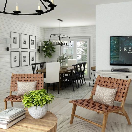 a living room filled with furniture and a flat screen tv