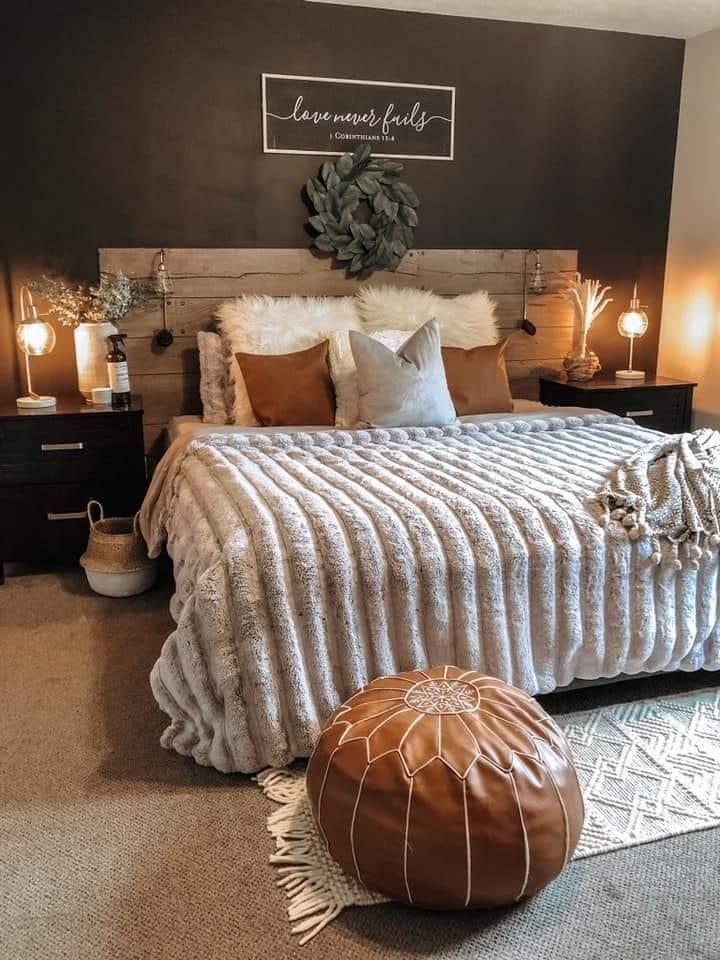 a large bed sitting in a bedroom on top of a carpeted floor next to two lamps