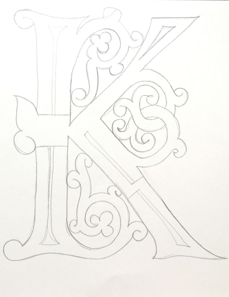 the letter k is drawn in pencil on paper