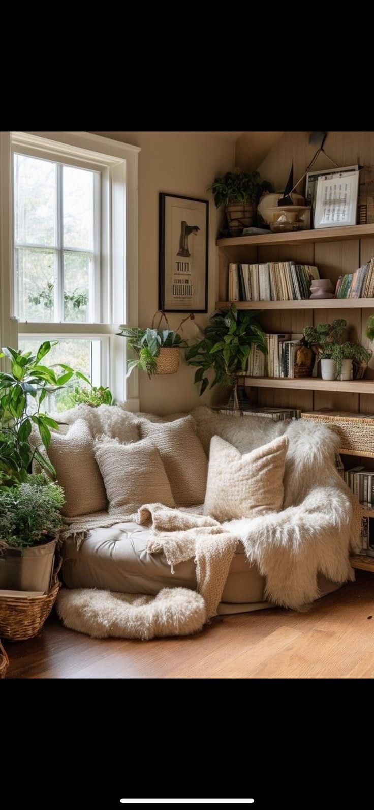 a living room filled with furniture and lots of plants