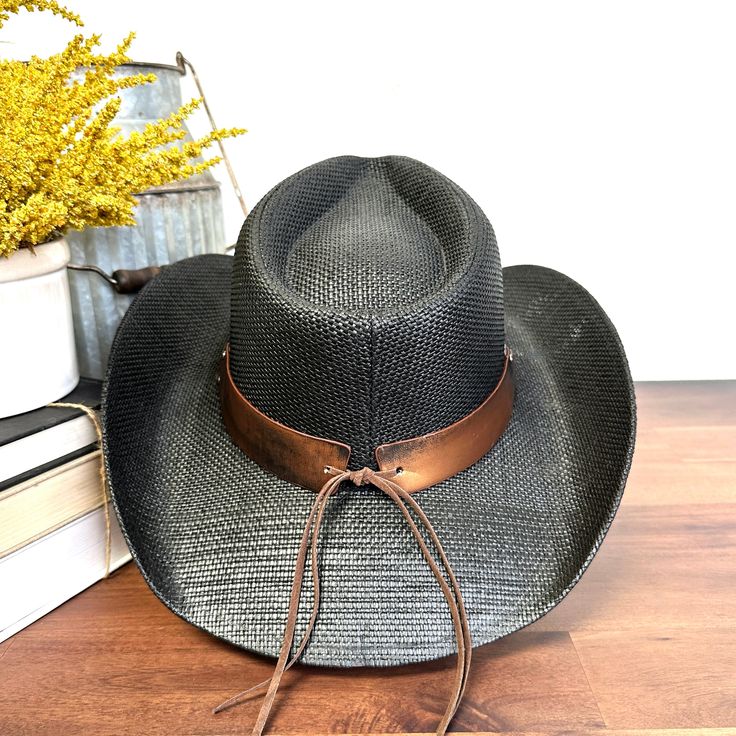 Elevate your cowboy style with the Taylor Stampede Cowboy Hat! Crafted with high-quality materials, this hat is designed to make a statement. The Taylor cowboy hat is durable, stylish, and perfect for any outdoor adventure. Stay protected from the sun while looking effortlessly stylish. OSFM (One Size Fits Most) Adjustable Straw Fedora For Rodeo, Adjustable Straw Panama Hat For Western-themed Events, Adjustable Western Panama Hat For Outdoor, Western Style Adjustable Wide Brim Panama Hat, Western Wide Brim Straw Fedora, Adjustable Western Straw Hat For Kentucky Derby, Western Straw Hat For Kentucky Derby, Western Straw Hat Bands For Kentucky Derby, Western Style Fedora Panama Hat For Outdoor