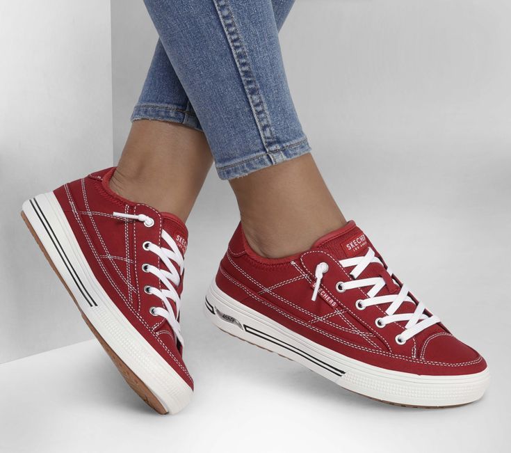 Walk in supportive comfort with a stylish classic wearing Skechers Street Arch Fit® Arcade - Arcata. This easy-wearing design features a canvas upper with decorative laces  removable Arch Fit® insole and a lightweight cushioned midsole. Dressy Sneakers, Wide Shoes, Shoe Boot Sandals, Navy Fashion, Skechers Women, Skechers Shoes, Red Fashion, Cute Shoes, Womens Shoes Sneakers