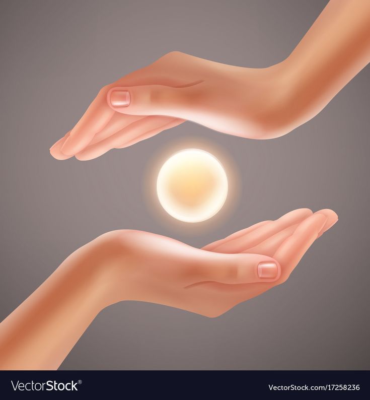 two hands reaching out towards each other with a glowing ball in the middle of them