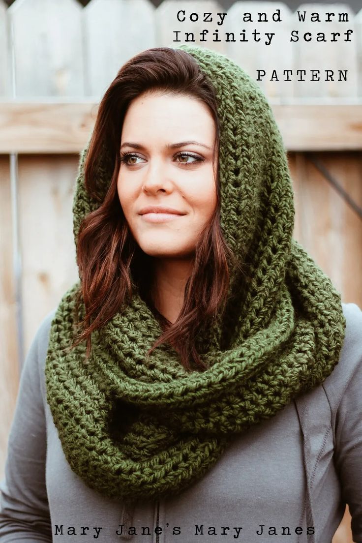 a woman wearing a green knitted cowl scarf